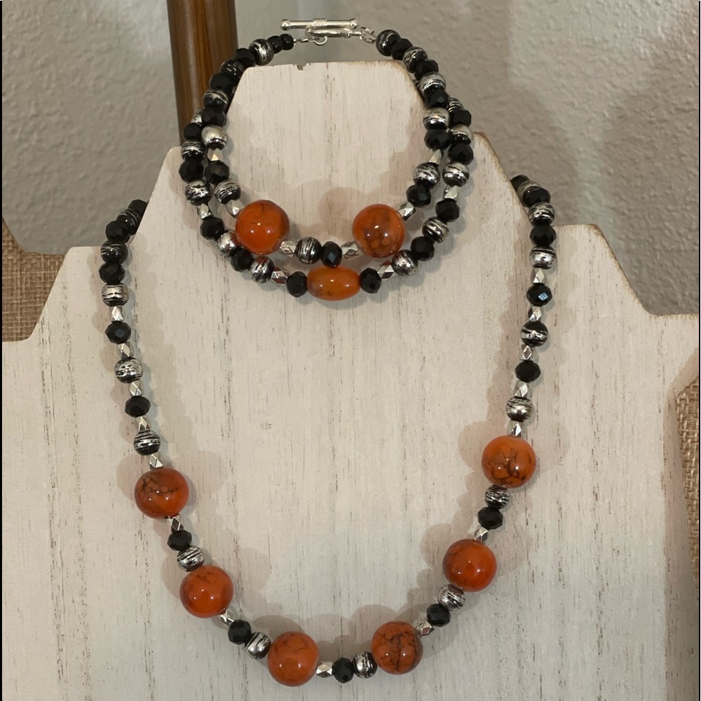 Black and orange necklace and bracelet set.